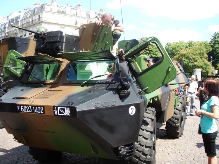 military armored vehicles on display for people to see