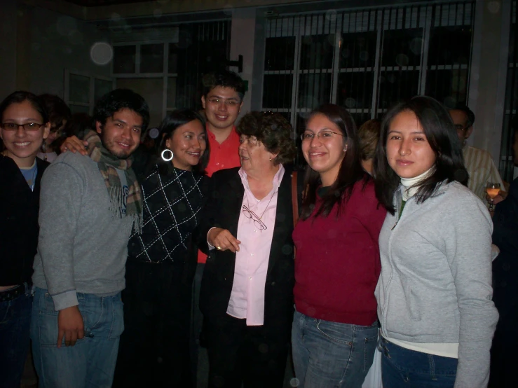 a group of people are smiling together for the camera