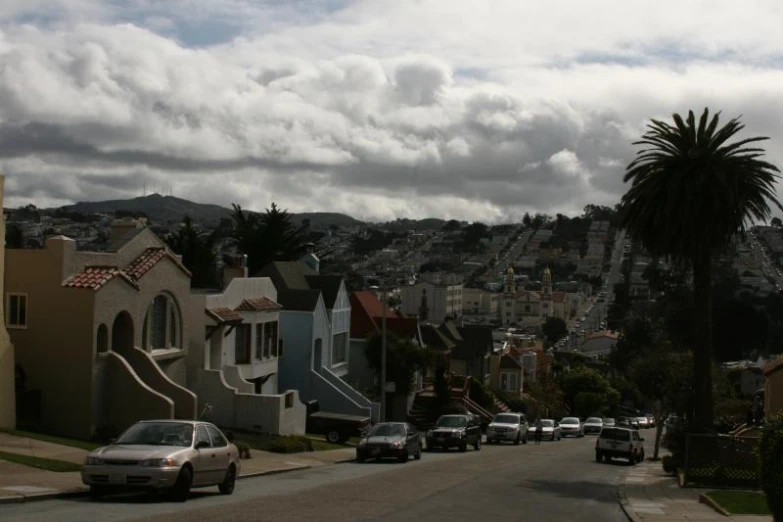 cars are parked on the side of a street