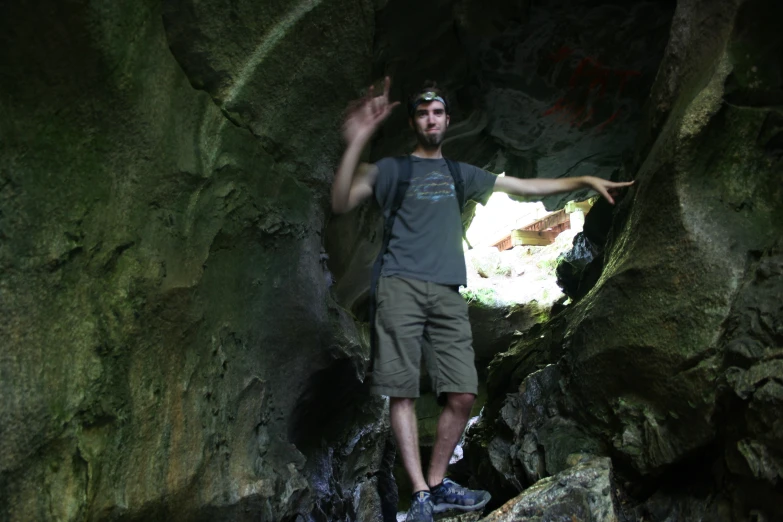 man in a cave with a hawk on it