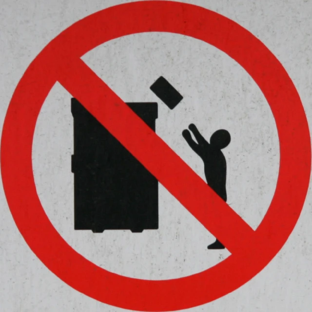 a red and black sign stating people to banish