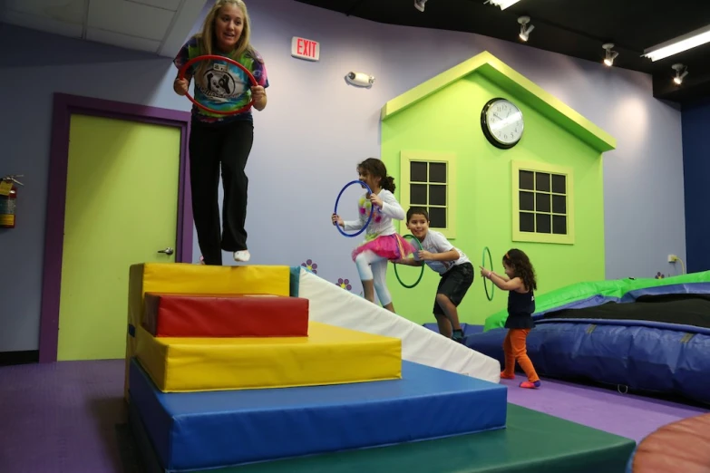 some children playing in a large indoor play area