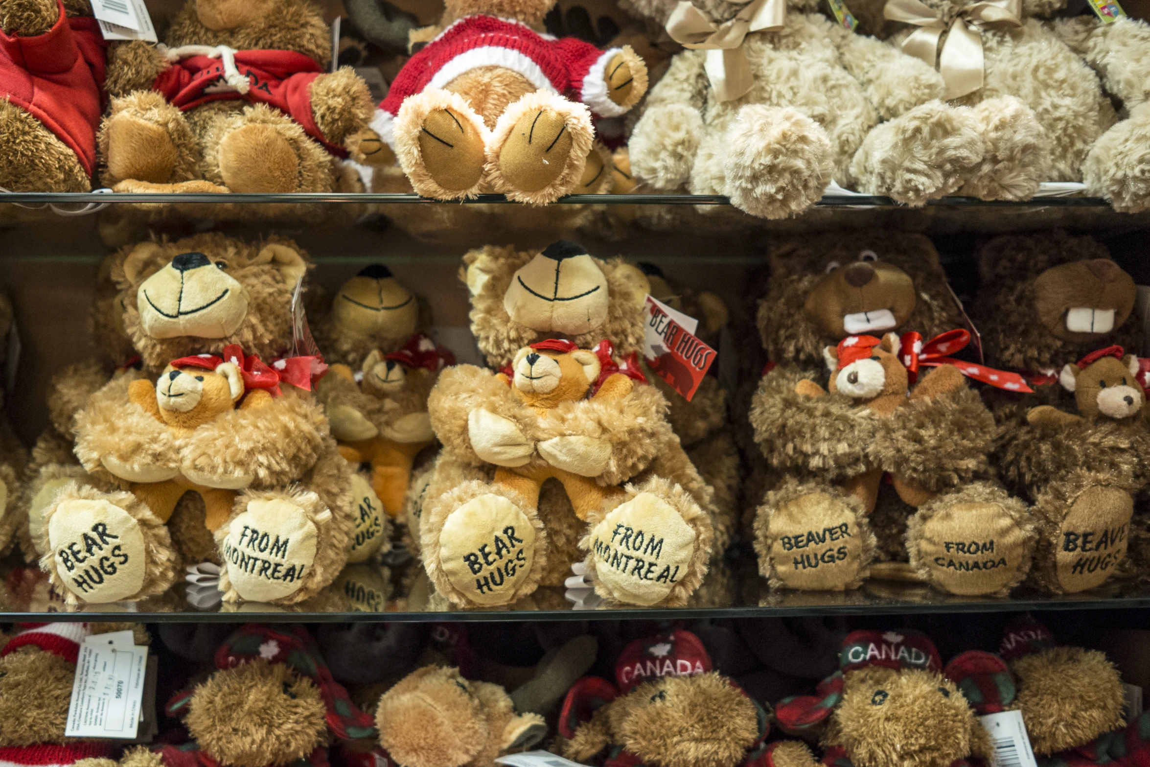 many brown teddy bears and other stuffed animals