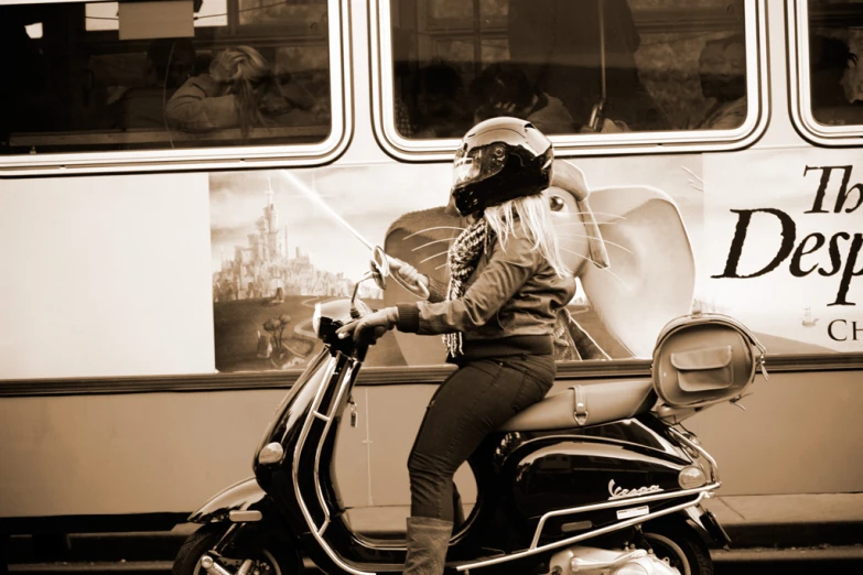 a woman wearing a helmet and sitting on a motorcycle