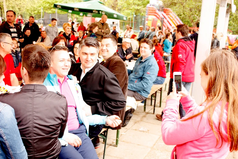 a man taking a picture of a crowd