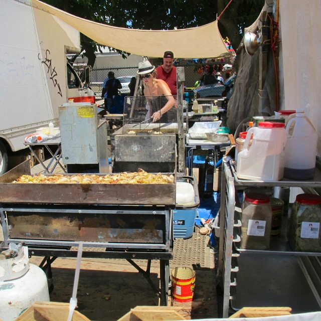 a man is making food from a wooden table