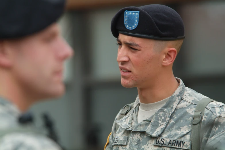 two soldiers are walking and looking at each other