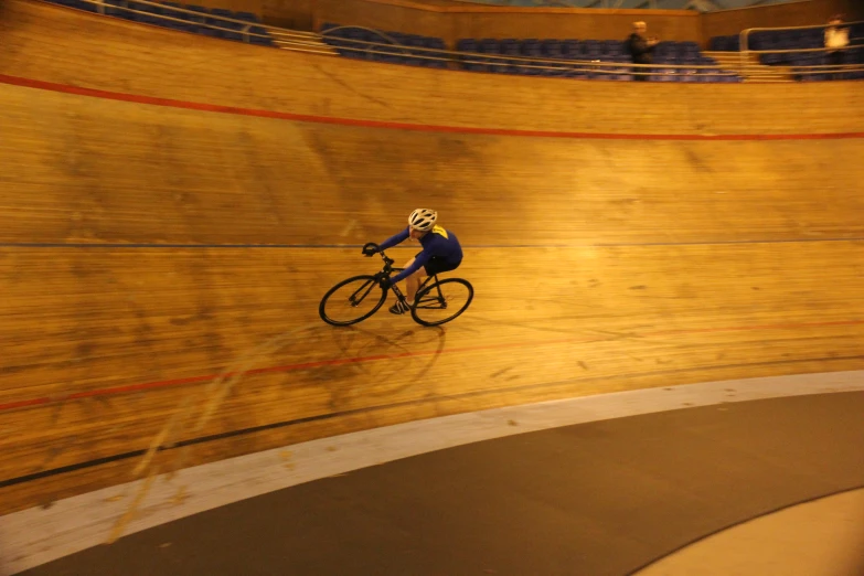 a male cyclist on a bike in the bike track