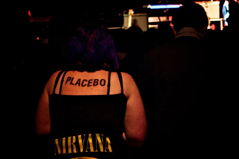 a back of a womans stomach with the words placebo on it