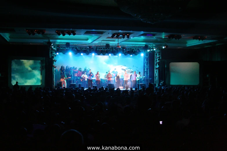 the big crowd is attending the concert on stage