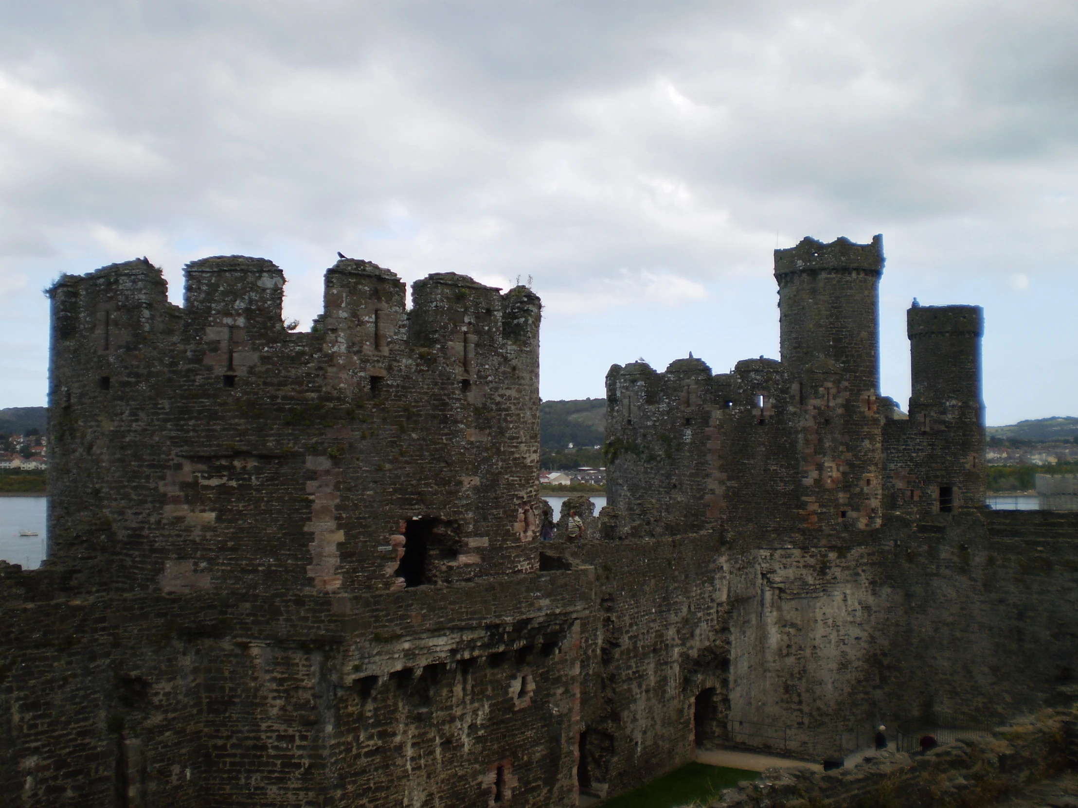 castle with stone walls and gray clouds in background