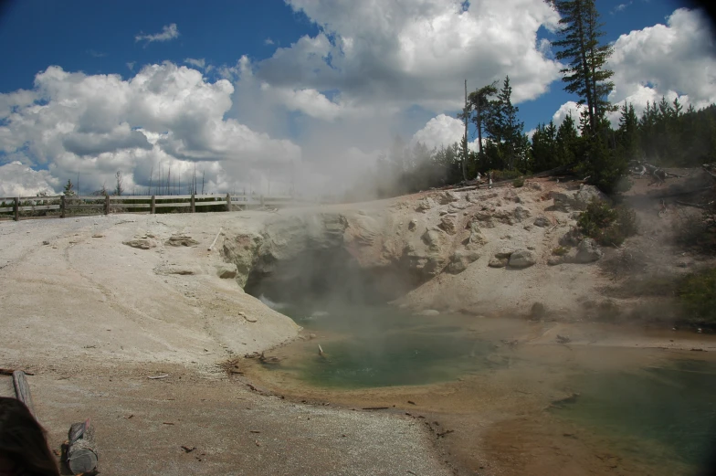 a geyser in a  place on a sunny day
