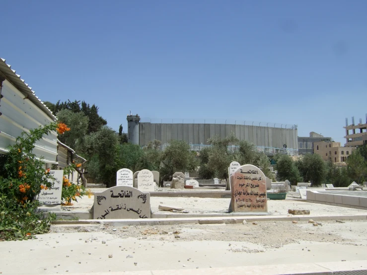 the cemetery has three headstones and one is empty