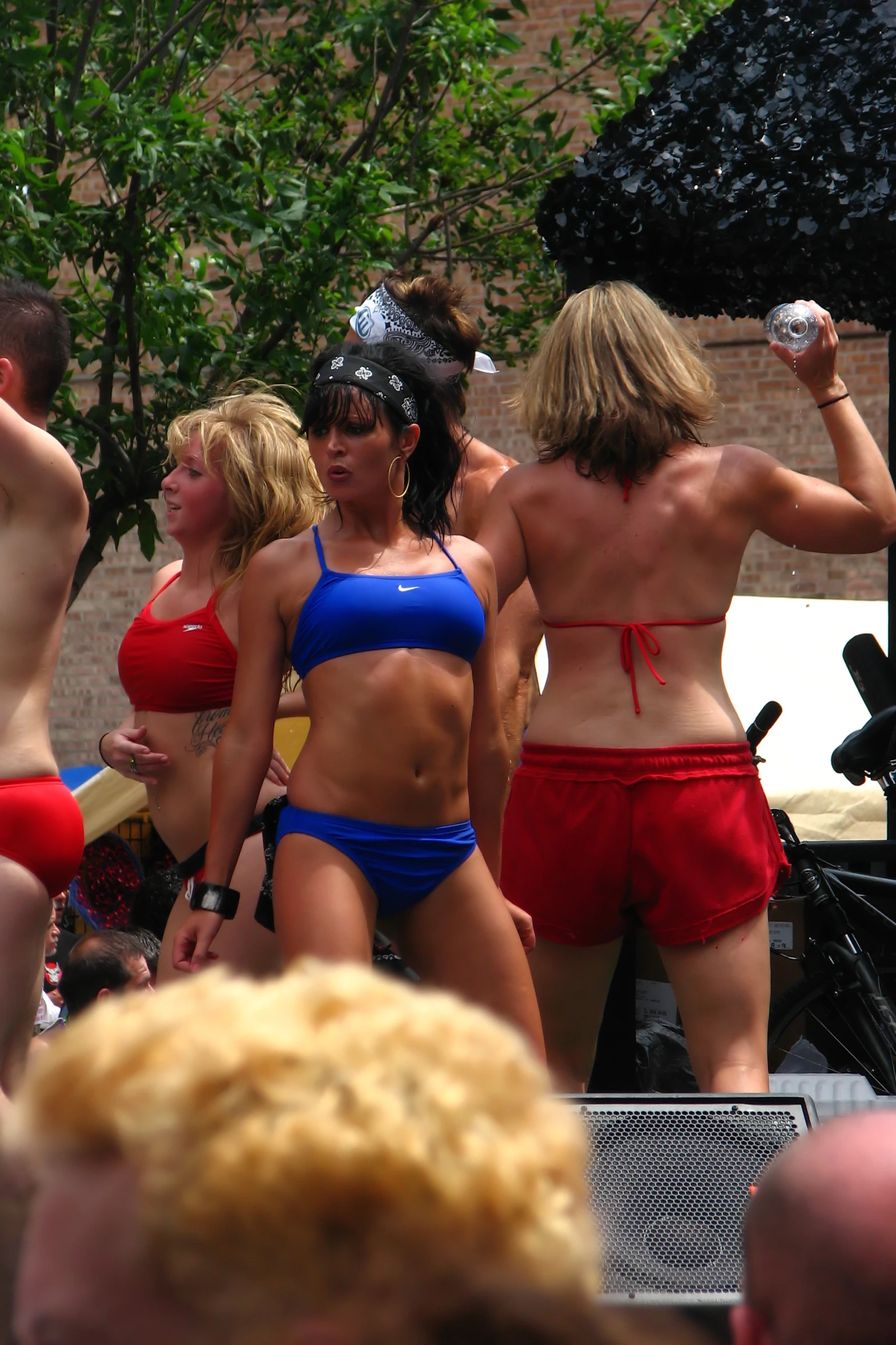 several women in swim suits standing around