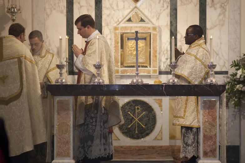 people are attending the mass in a church