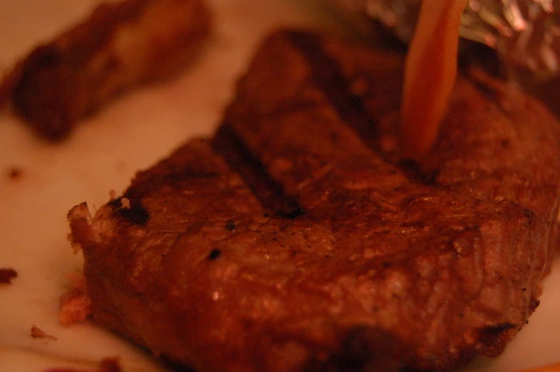 a steak is shown as it sits on a plate
