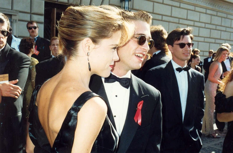 the two men are in black tuxedo at an event