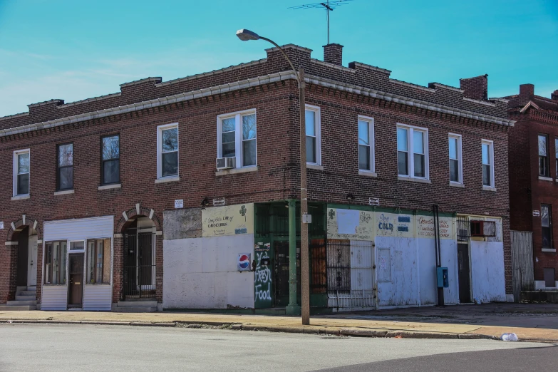 this old building has broken down doors and broken windows