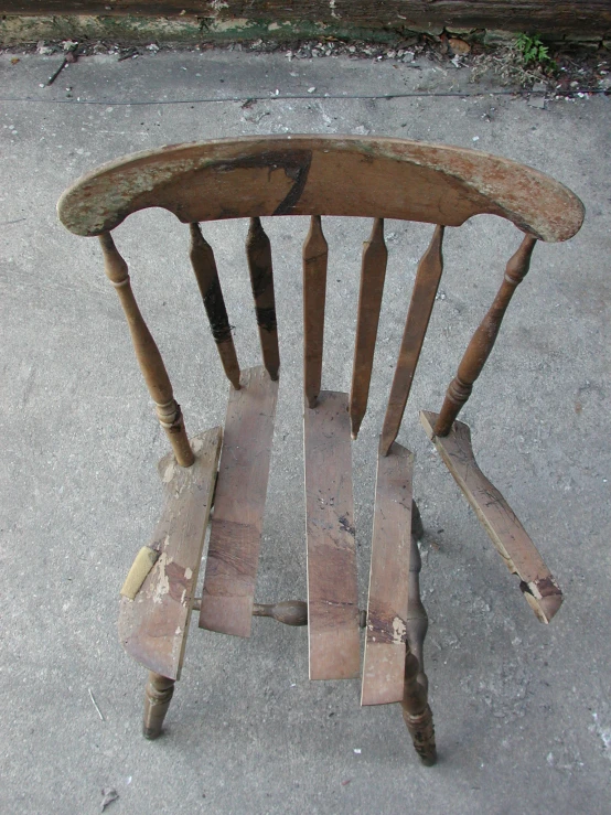 there is a wooden chair made out of different pieces of wood
