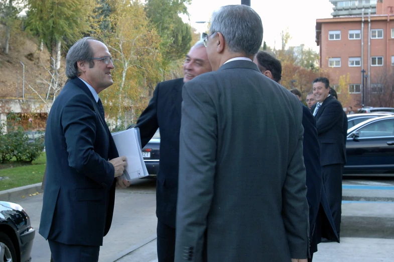 a couple of men standing next to each other