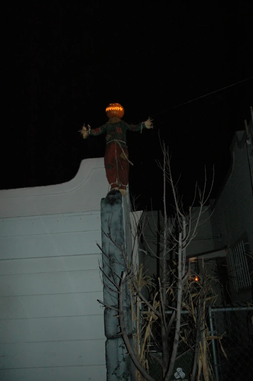 a person is skateboarding on a rail in the dark