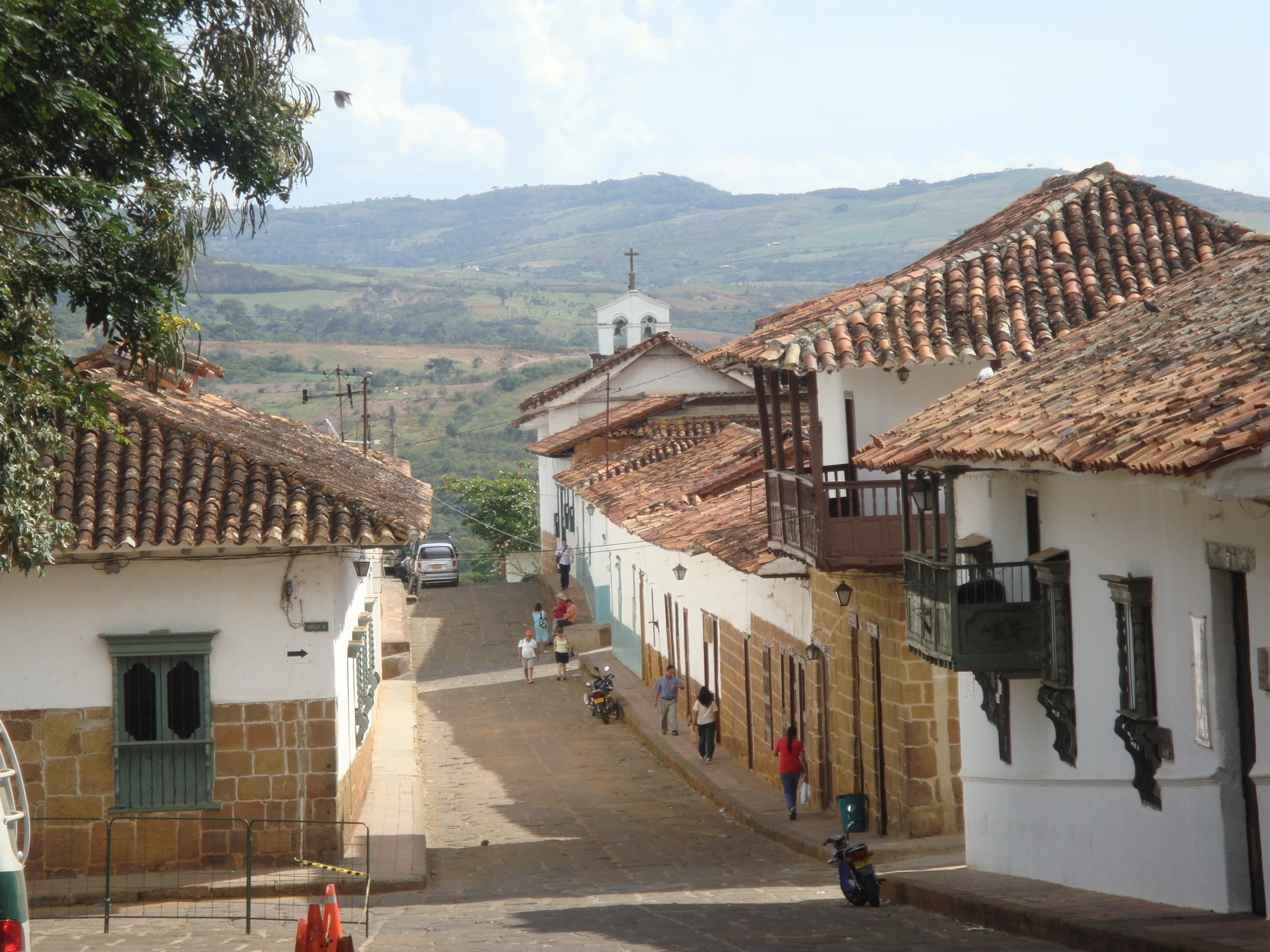 a street that has many white and brown buildings