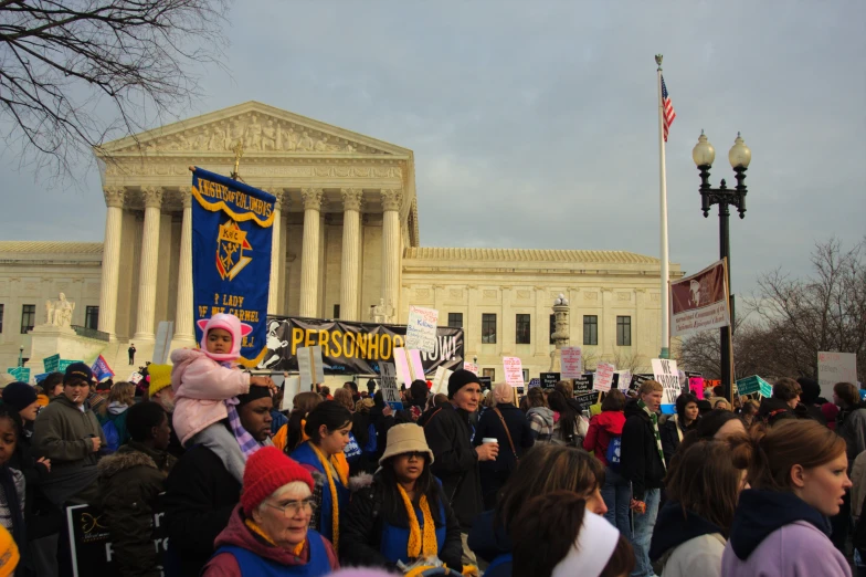 a protest for the supreme court in front of the supreme building