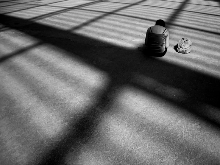 a person sitting down reading a book