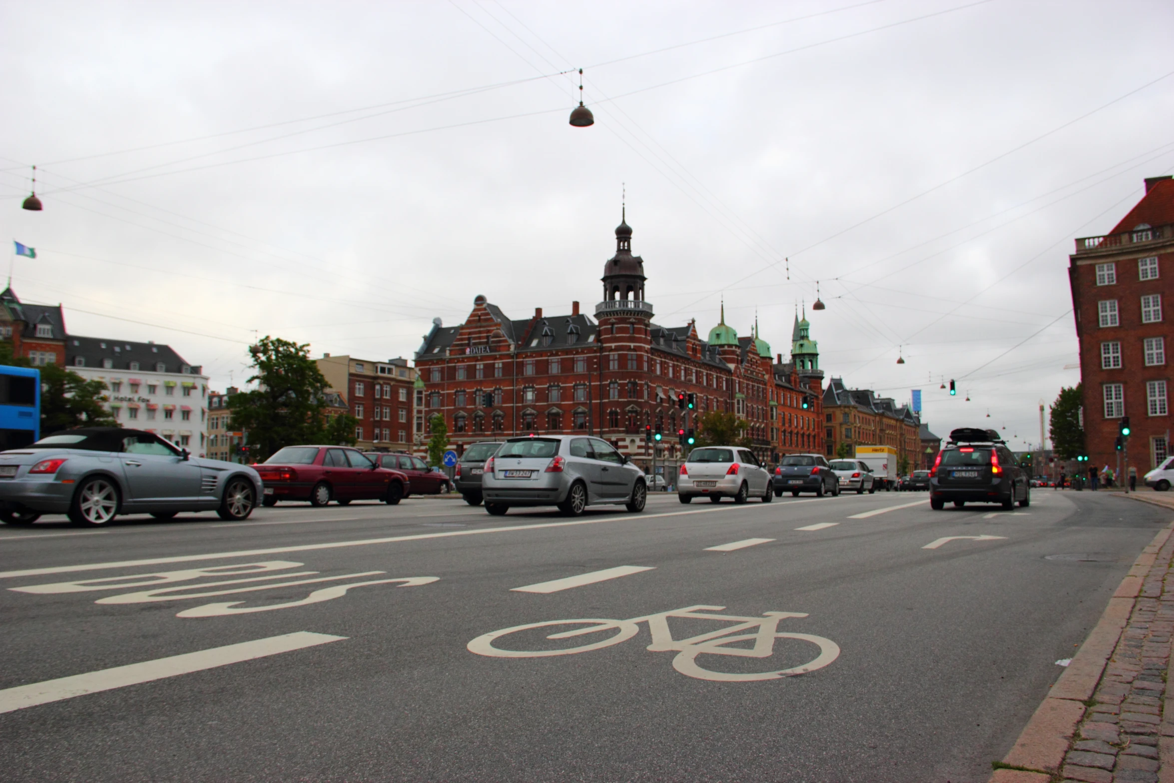 a number of cars parked on the side of a street