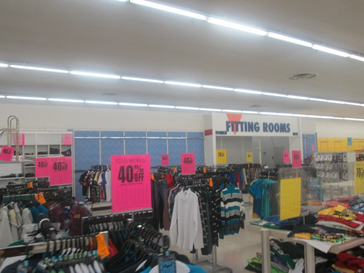 a large store with clothes hanging on the racks