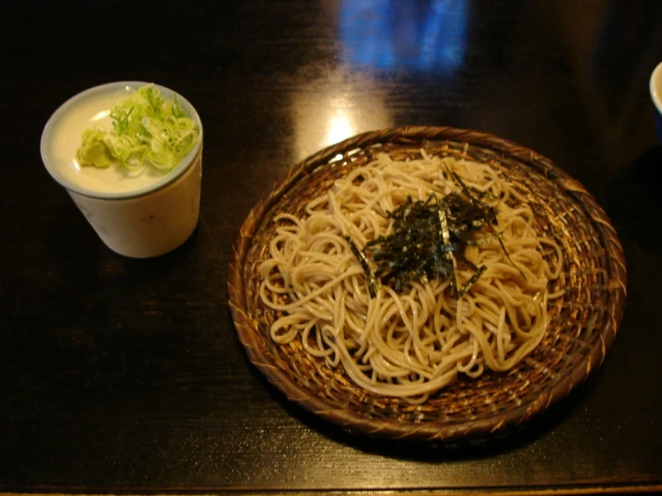 a close up of a plate of noodles on a table