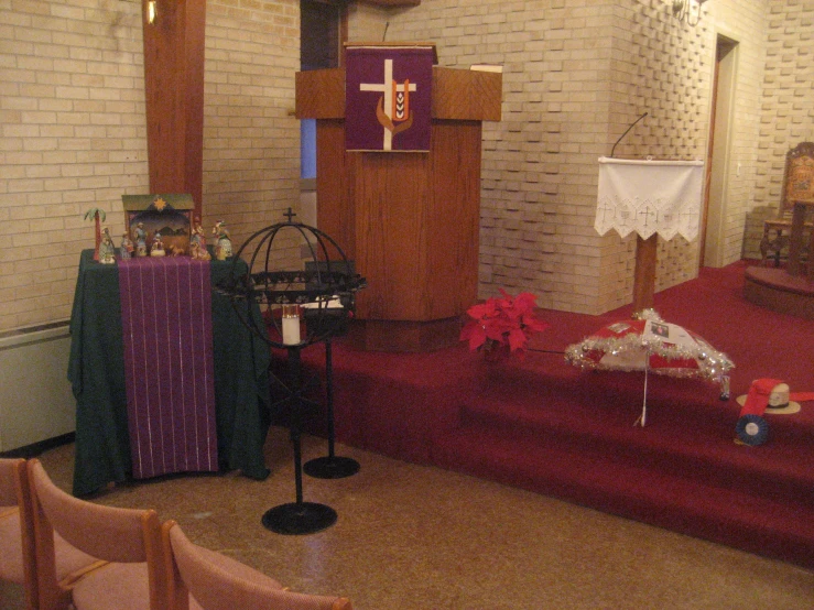 a church with many pieces of furniture, and altar