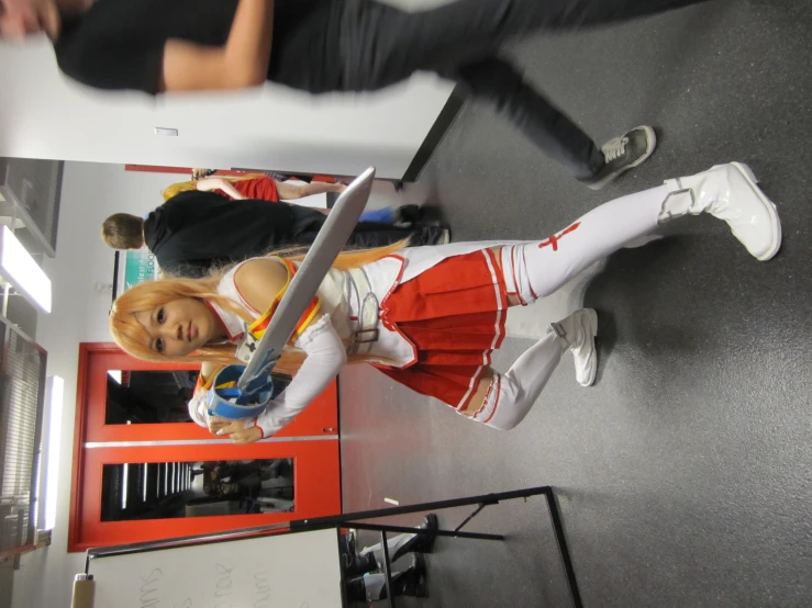 a person wearing a costume posing for a picture with a sword