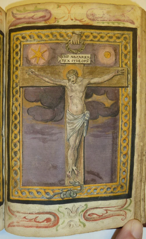 the cross is displayed in this book with an elaborate design