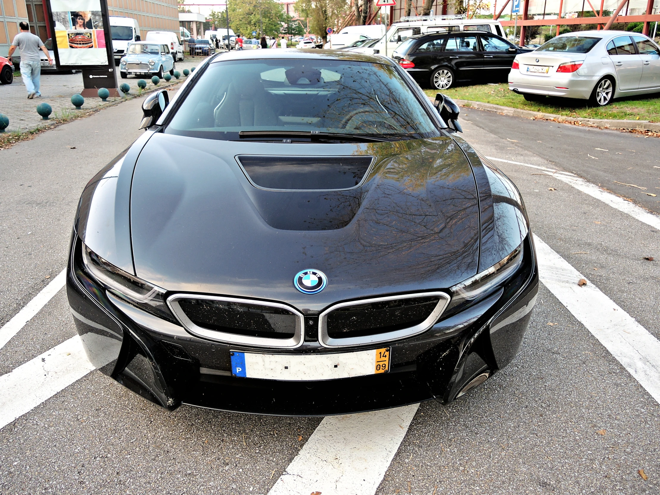 a bmw car is parked on a city street