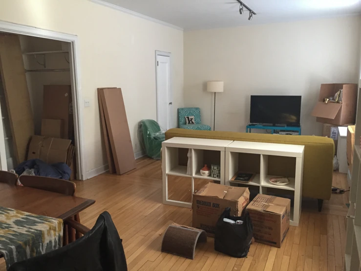 this is an image of a living room with boxes on the floor