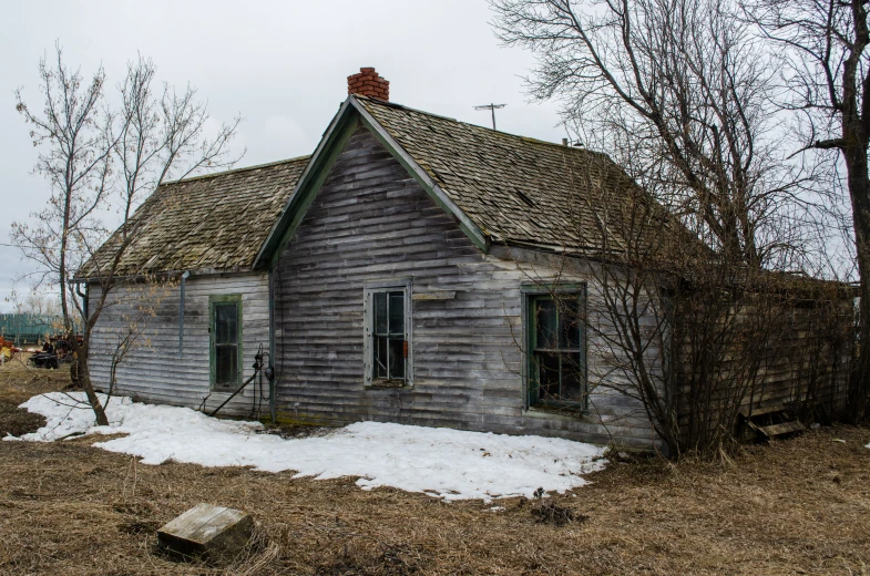 a small house with a small window and a red roof