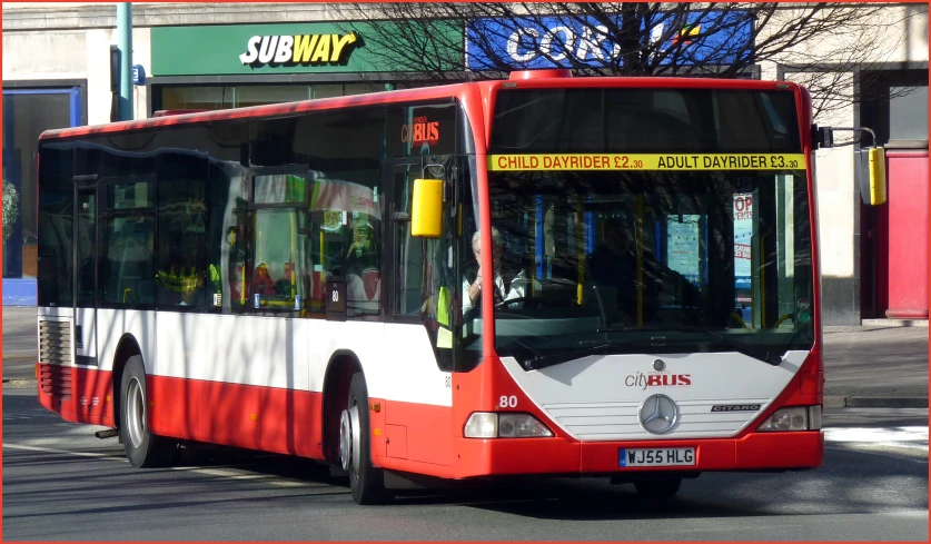 a large bus on a city street in europe