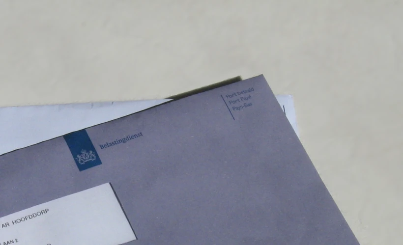 envelopes, with small paper notes stuck to them