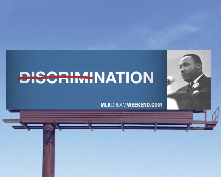 a blue billboard with a pograph of martin luther b king