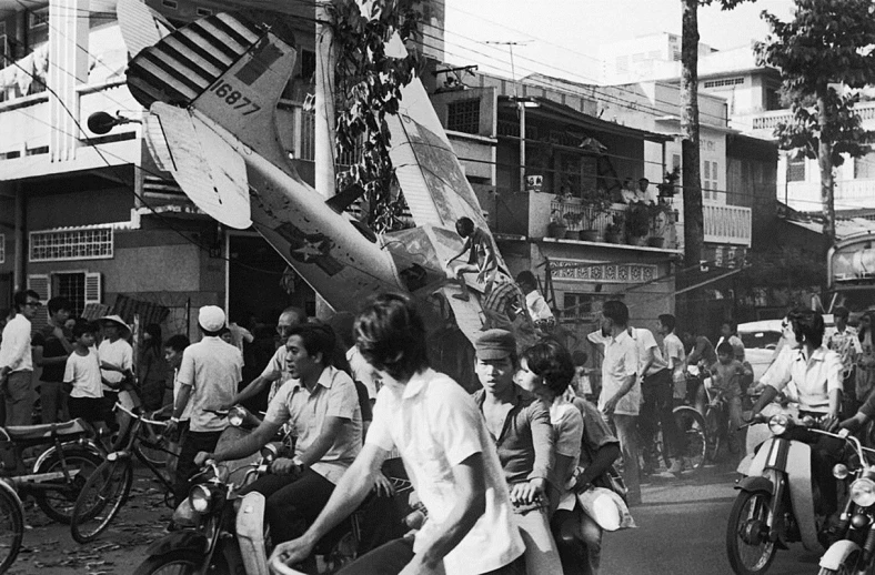 an old black and white po of several people on motor bikes