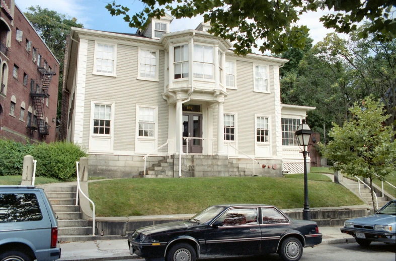 a classic car is parked on the street