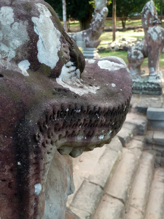 close up of the stone statues in the park