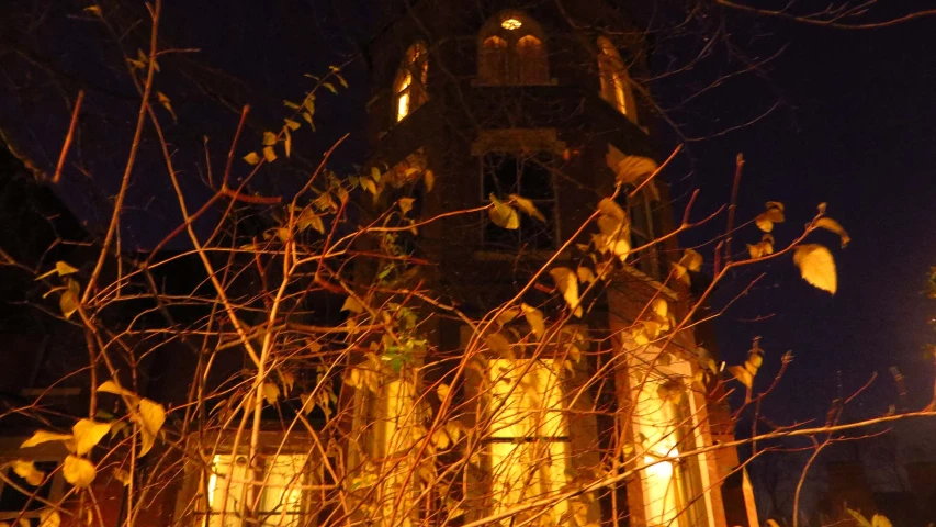 a building with a clock tower in the background