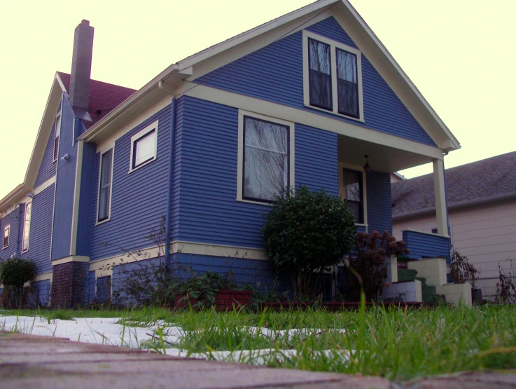 the blue house has two large windows