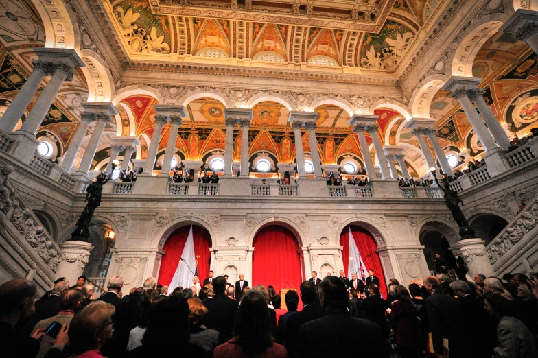 a view of a large crowd in front of a big stair