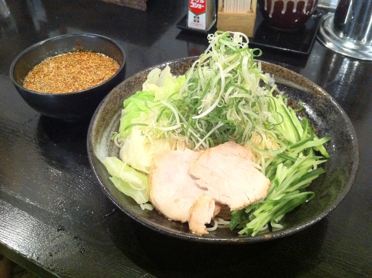 a close up of a bowl of food on a table