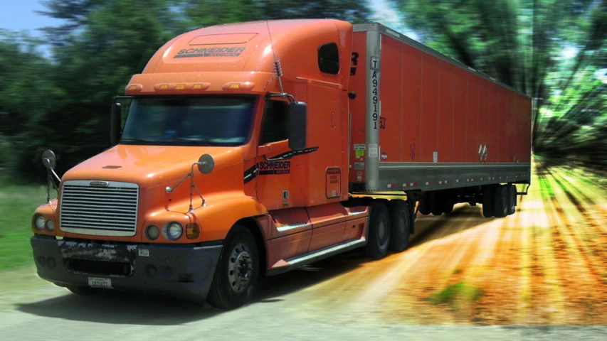 a truck traveling down the middle of a road