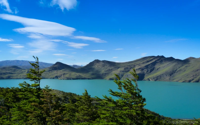 a beautiful landscape with a lake surrounded by mountains