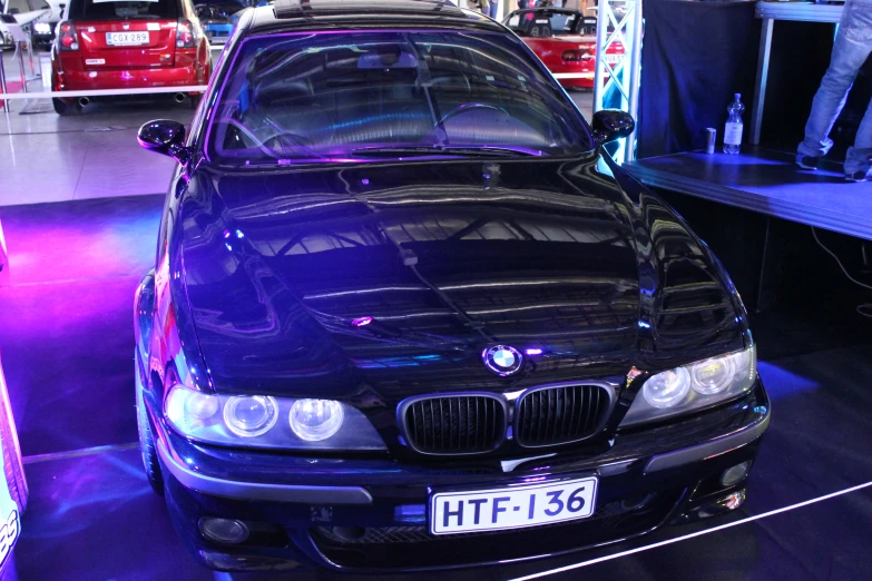 an automobile is sitting on display in the car showroom